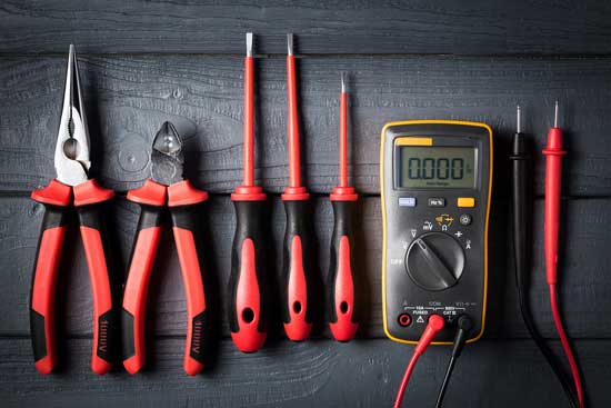 electrician's tools laid out in an organized fashion