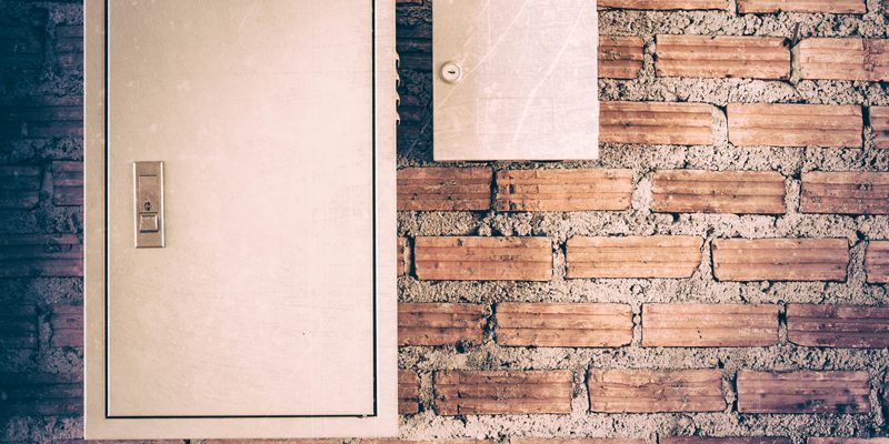 Electrical panel on a brick wall
