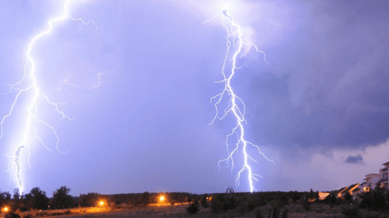 Two big lightning strikes in the night sky