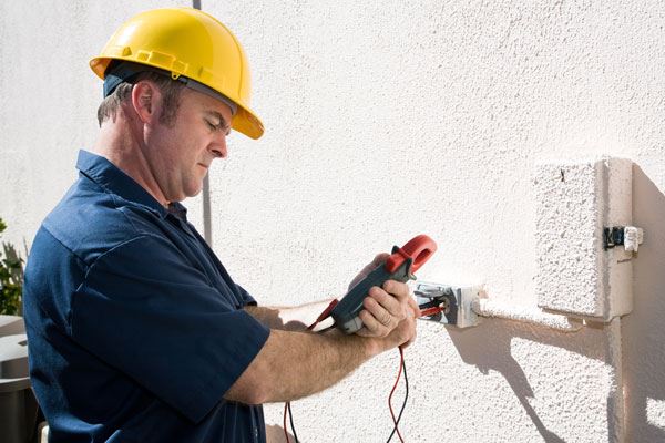 Electrician completing an electrical inspection